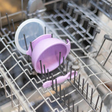 Load image into Gallery viewer, Bumkins Silicone First Feeding Set: Lavender sits in the top rack of an open dishwasher.