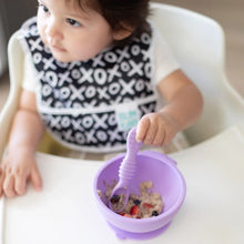 Load image into Gallery viewer, A child in a high chair with a bib enjoys oatmeal and berries from a Bumkins Silicone First Feeding Set: Lavender