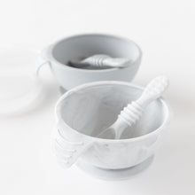 Load image into Gallery viewer, Bumkins Silicone First Feeding Set: Marble sits in front of a gray bowl and spoon set on a white background.