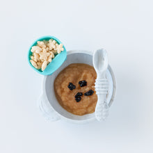Load image into Gallery viewer, Bumkins Silicone First Feeding Set: Marble with applesauce and berries and a blue cup of star-shaped puffs on a white background.