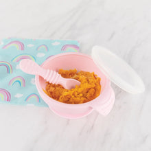 Load image into Gallery viewer, Bumkins Silicone First Feeding Set: Pink with orange mash on a marble surface next to a rainbow print pouch.