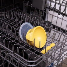 Load image into Gallery viewer, Bumkins Silicone First Feeding Set: Pineapple sits in the top rack of an open dishwasher.