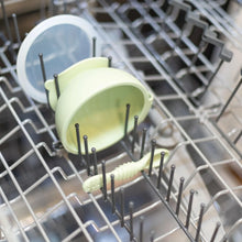 Load image into Gallery viewer, Bumkins Silicone First Feeding Set: Sage sits in the top rack of an open dishwasher.