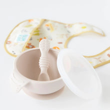 Load image into Gallery viewer, Bumkins Silicone First Feeding Set: Sand sits on a white background, with a colorful bib blurred behind.
