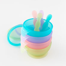 Load image into Gallery viewer, A stack of four colorful bowls and spoons on a white background, featuring Bumkins Silicone First Feeding Set: Blue Jelly on top.