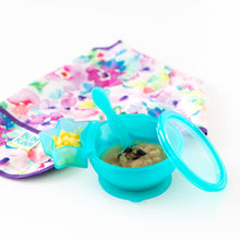 Load image into Gallery viewer, Bumkins Silicone First Feeding Set: Blue Jelly with applesauce, sits next to a floral bib and a blue star-shaped cup on a white background.