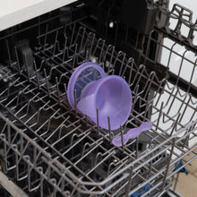 Load image into Gallery viewer, Bumkins Silicone First Feeding Set: Purple Jelly sits in the top rack of an open dishwasher.