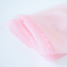 Load image into Gallery viewer, Close-up of Bumkins Silicone Flat Reusable Bag 2 Pack, Pink, with focus on the leak-proof, child-friendly closure.
