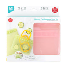 Load image into Gallery viewer, Bumkins Silicone Flat Reusable Bag 2 Pack, Pink is shown in a white packaging box with a clear front window partially displaying the bags.