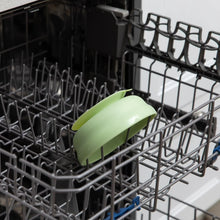 Load image into Gallery viewer, Bumkins Silicone Grip Bowl: Sage sits in the top rack of an open dishwasher.