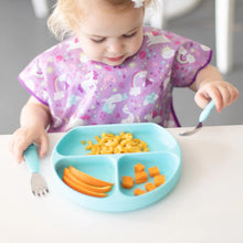 Load image into Gallery viewer, A toddler in a unicorn bib enjoys mac and cheese, apples, and cheese from a blue plate with Bumkins Spoon + Fork: Blue at a white table.