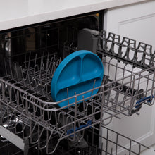 Load image into Gallery viewer, Bumkins Silicone Grip Dish: Dark Blue sits in the top rack of an open dishwasher.