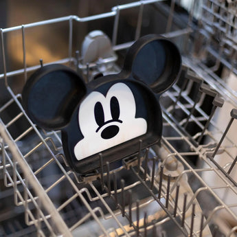 Bumkins Silicone Grip Dish: Mickey Mouse sits in the top rack of an open dishwasher.
