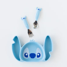 Load image into Gallery viewer, Bumkins Silicone Grip Dish: Stitch sits on a white background below toddler utensils with Stitch-shaped handles.