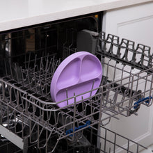 Load image into Gallery viewer, Bumkins Silicone Grip Dish: Lavender sits in the top rack of an open dishwasher.