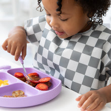 Load image into Gallery viewer, Close-up of a girl in a gray & white bib eating fruit from a purple plate with Bumkins Spoon + Fork: Lavender.