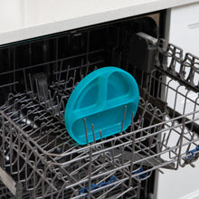 Load image into Gallery viewer, Bumkins Silicone Grip Dish: Blue Jelly sits in the top rack of an open dishwasher.