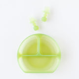 Bumkins Silicone Chewtensils®: Green Jelly rest above a matching divided plate on a white background.