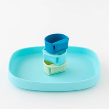 Load image into Gallery viewer, Bumkins Silicone Little Dipper Round 3-Pack: Gumdrop sits stacked inside a blue silicone tray on a white background.