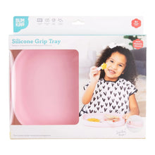 Load image into Gallery viewer, Bumkins Silicone Grip Tray: Pink in a white packaging box with a photo of a child and a clear window partially displaying the dish.