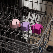 Load image into Gallery viewer, Bumkins Silicone Little Dipper 3-Pack: Lollipop sits in the top rack of an open dishwasher.