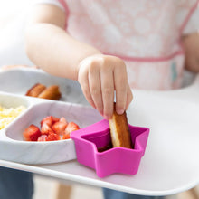 Load image into Gallery viewer, Close-up of a child dipping French toast in a fuchsia Bumkins Silicone Little Dipper 3-Pack: Lollipop, attached to a plate on a high chair.