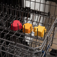 Load image into Gallery viewer, Bumkins Silicone Little Dipper 3-Pack: Tutti-Frutti sits in the top rack of an open dishwasher.
