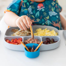 Load image into Gallery viewer, A child dipping pretzels into chocolate from a blue Bumkins Silicone Little Dipper Round 3-Pack: Gumdrop, attached to a plate of food.