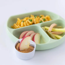 Load image into Gallery viewer, A green plate with food, and a marble Bumkins Silicone Little Dipper Round 3-Pack: Taffy with peanut butter on a white background.