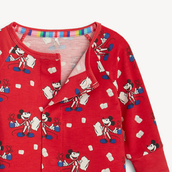 Close-up of magnetic closure of Magnetic Me, Coverall Red Cocoa Club red long sleeve coverall pajamas with Mickey Mouse design.