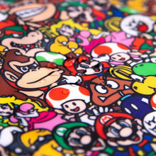 Load image into Gallery viewer, Close-up of water droplets on Bumkins Sleeved Bib: Super Mario™ Mashup.
