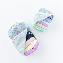 Load image into Gallery viewer, Bumkins Packing Cube 2 Pack: Aloha Stitch is filled with pastel clothes on a white background.