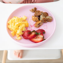 Load image into Gallery viewer, Bumkins Silicone Plate + Spoon Set: Disney Princess sits on a high chair tray with breakfast; a child's foot is visible underneath.
