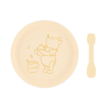 Bumkins Silicone Plate + Spoon Set: Disney Winnie the Pooh includes a silicone plate with a Winnie the Pooh illustration and a matching spoon.