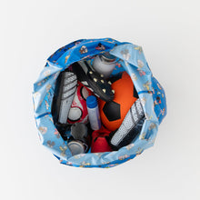 Load image into Gallery viewer, Aerial view of Bumkins Packable Tote Bag: Mickey & Friends Forever holding a soccer ball, shoes, and bottle on white background.