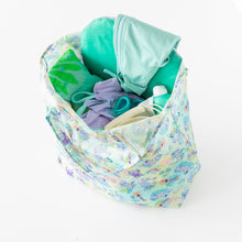 Load image into Gallery viewer, Bumkins Packable Tote Bag: Aloha Stitch sits open on a white background, with swim gear inside.