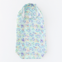 Load image into Gallery viewer, A Bumkins Packable Tote Bag: Aloha Stitch folds itself into its pocket on a white background in a stop motion GIF.
