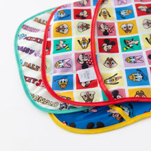 Load image into Gallery viewer, Close-up of Bumkins SuperBib® 3 Pack: Mickey & Friends MVP on a white background, showcasing the pockets.