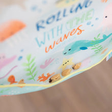 Load image into Gallery viewer, Close-up of cookies in the pocket of a Bumkins SuperBib® 3 Pack: Rolling With the Waves.