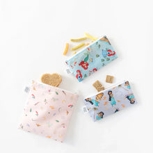 Load image into Gallery viewer, Bumkins Reusable Snack Bag, 3-Pack: Princess Magic, Ariel, and Jasmine lays on a white background with snacks spilling out of each bag.
