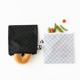 Roamio by Bumkins Reusable Snack Bag, Large 2 Pack: Rich & Boujee holds a bagel, tomatoes, and pea pods on a white background.