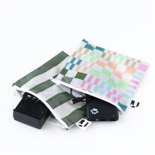 Load image into Gallery viewer, Roamio by Bumkins Reusable Snack Bag, Large 2 Pack: Motley Club lays open on a white background with electronics like a battery charger inside.