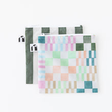 Load image into Gallery viewer, Roamio by Bumkins Reusable Snack Bag, Large 2 Pack: Motley Club lays overlapped on a white background.