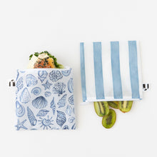 Load image into Gallery viewer, Roamio by Bumkins Reusable Snack Bag, Large 2 Pack: Coastal holds a sandwich and kiwi halves on a white background.