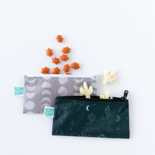 Load image into Gallery viewer, Bumkins Reusable Snack Bag, Small 2 Pack: Desert Night with star and cactus-shaped crackers spilling out on a white background.