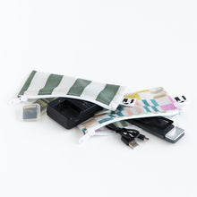 Load image into Gallery viewer, Roamio by Bumkins Reusable Snack Bag, Small 2 Pack: Motley Club lays open on a white background with electronics like a battery charger inside.