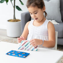 Load image into Gallery viewer, A girl eagerly opens Bumkins Reusable Snack Bag, Small 2 Pack: Mickey & Friends MVP at a white table.