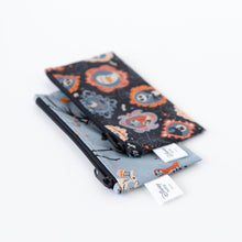 Load image into Gallery viewer, Bumkins Reusable Snack Bag, Small 2 Pack: Everyday Is Halloween sit overlapped at an angle on a white background.