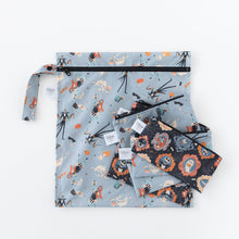 Load image into Gallery viewer, Bumkins Reusable Snack Bag, Small 2 Pack: Everyday Is Halloween lays on top of other bags with matching prints on a white background.