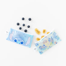 Load image into Gallery viewer, Bumkins Reusable Snack Bag, Small 2 Pack: Stitch Star-ring Up Trouble set on a white background, surrounded by blueberries and banana chips.